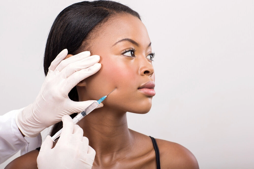 african american woman face lifting on her cheek